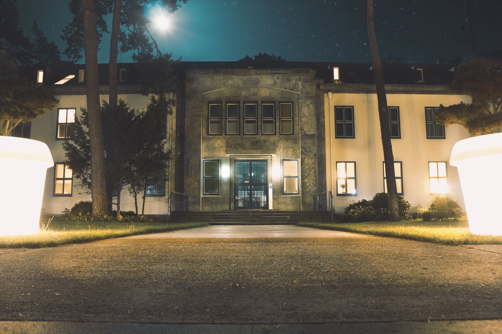 House exterior at dusk with warm lights